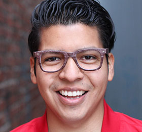Young man with glasses smiling