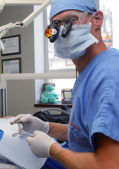 Male dentist examining a patient